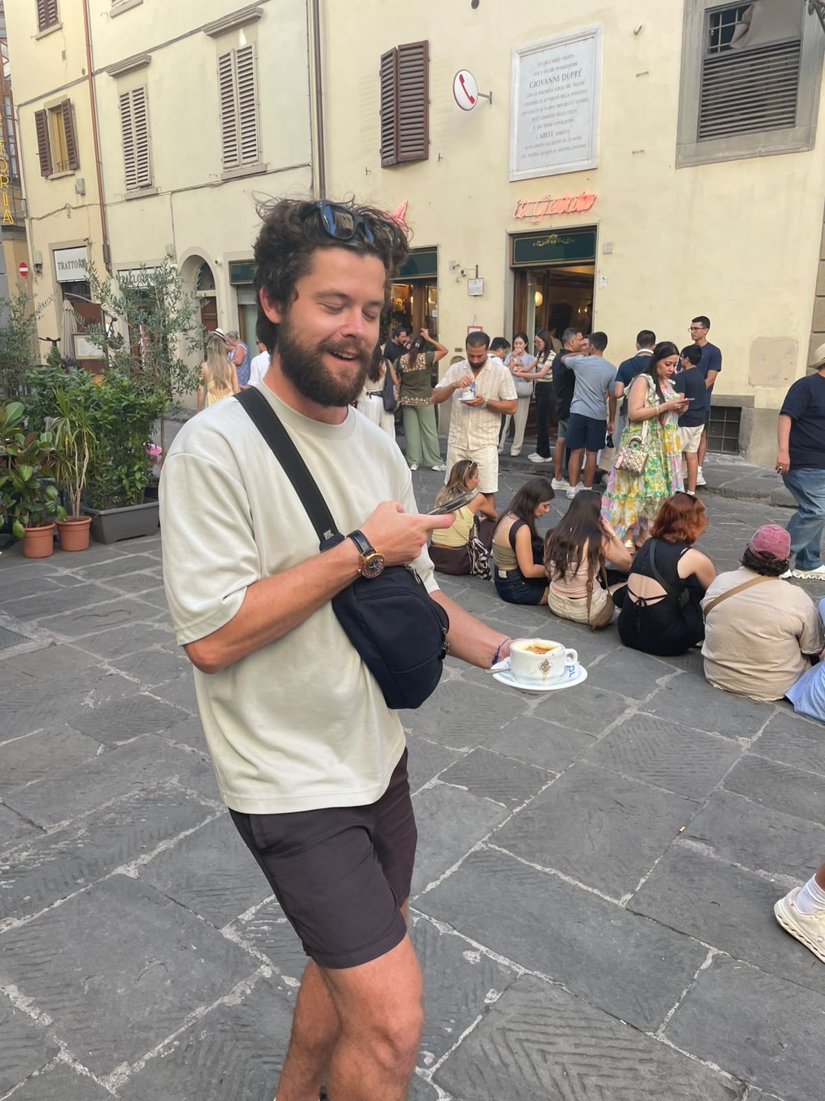 Guest holding an affogato in front of Vivoli gelateria in Florence