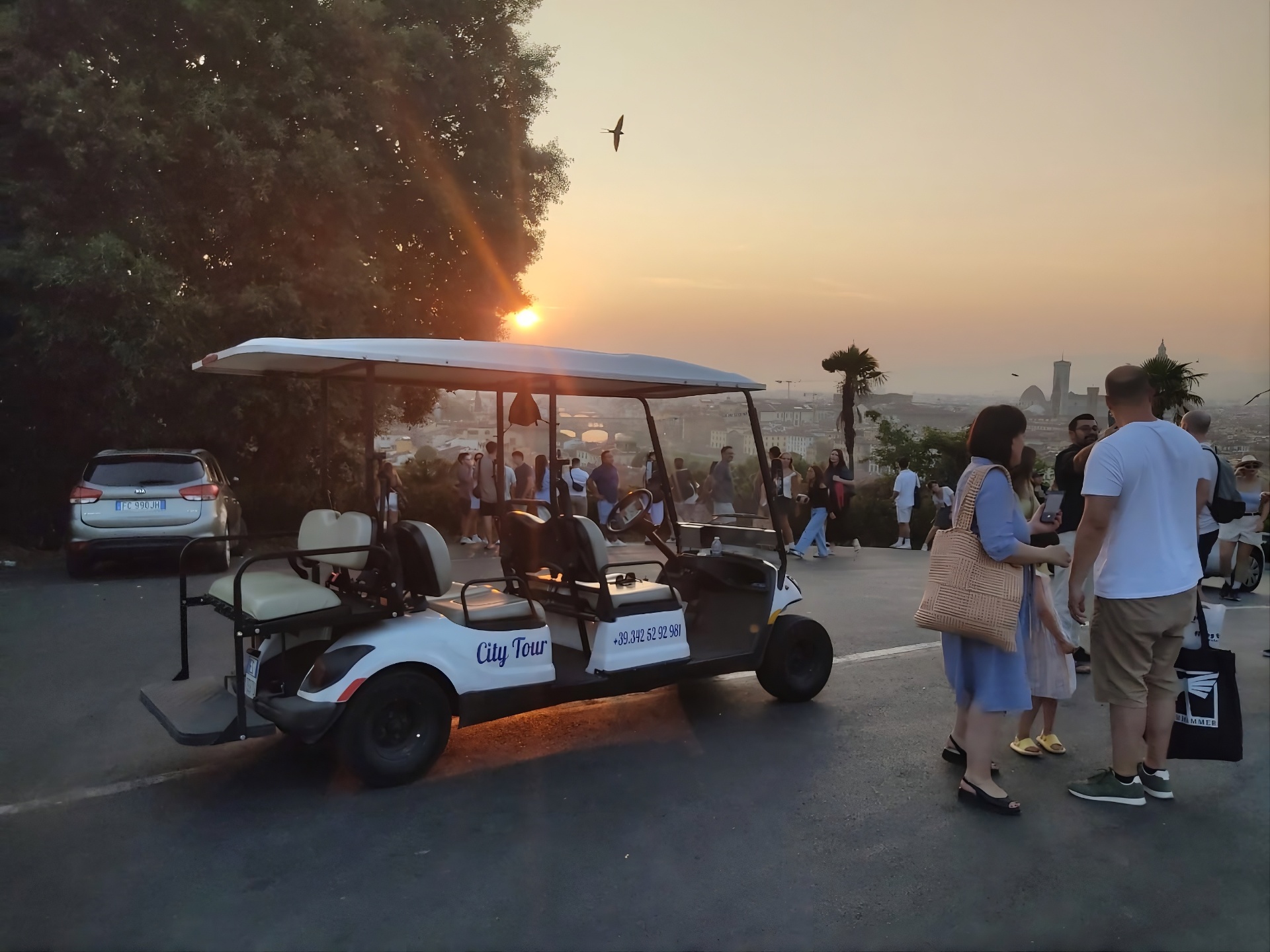 Private electric golf cart at Piazzale Michelangelo at sunset