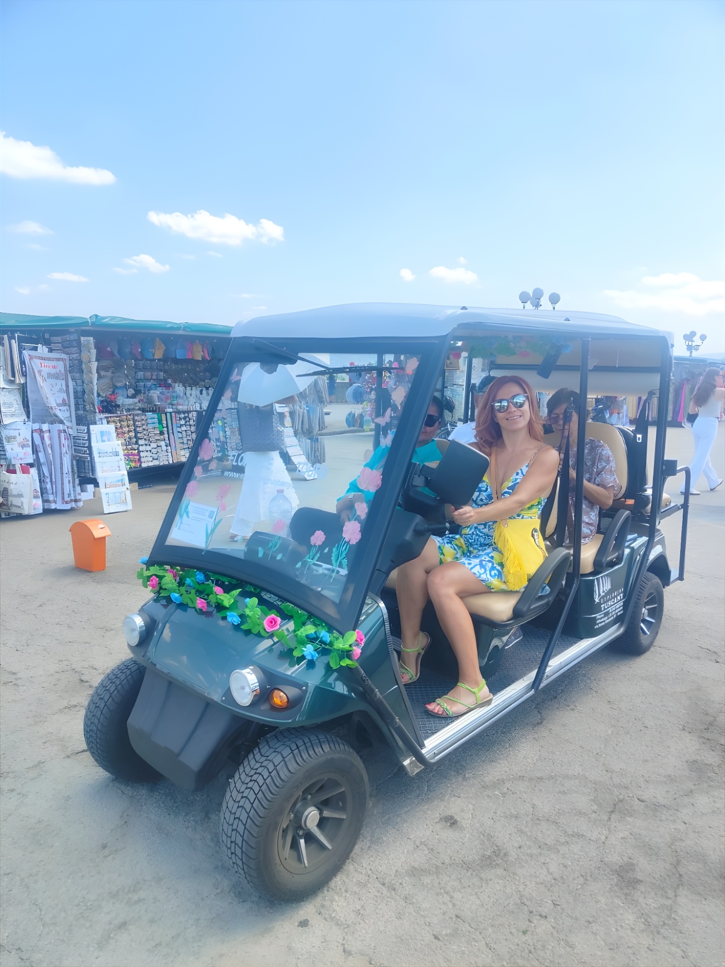 The AirStar golf cart parked at a Florentine market