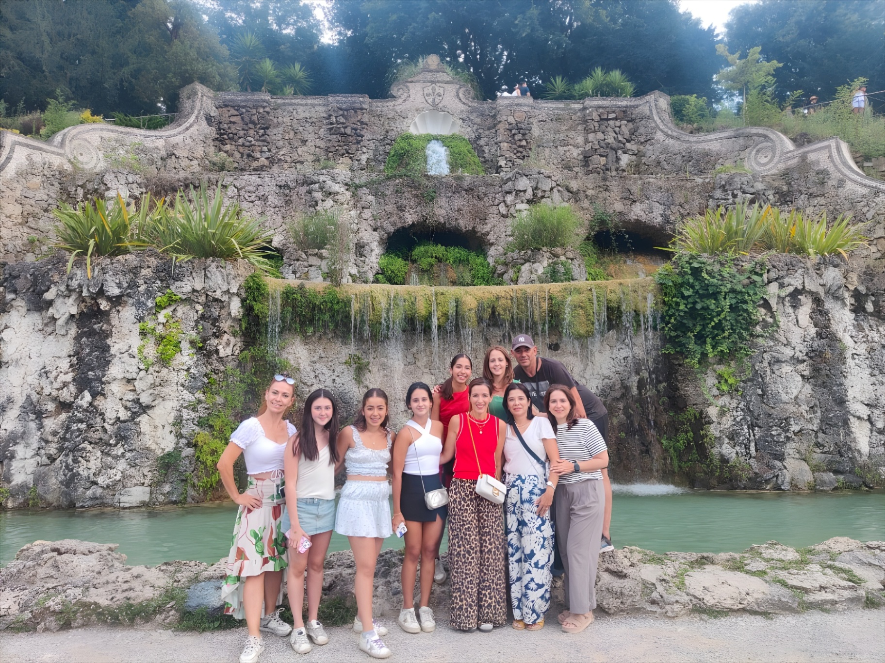 Tour group at a baroque fountain on the hills of Florence