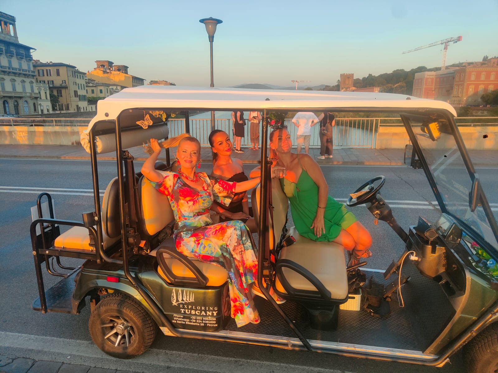 Tour guests in the City Tour cart at Piazzale Michelangelo in the evening